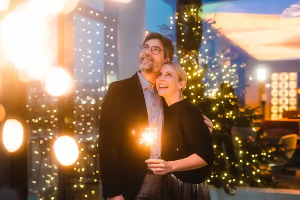 Couple with sparkler A man and a woman hold sparklers.